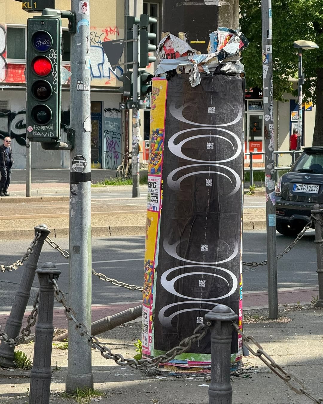 Posters for Contra are displayed on a street power line.